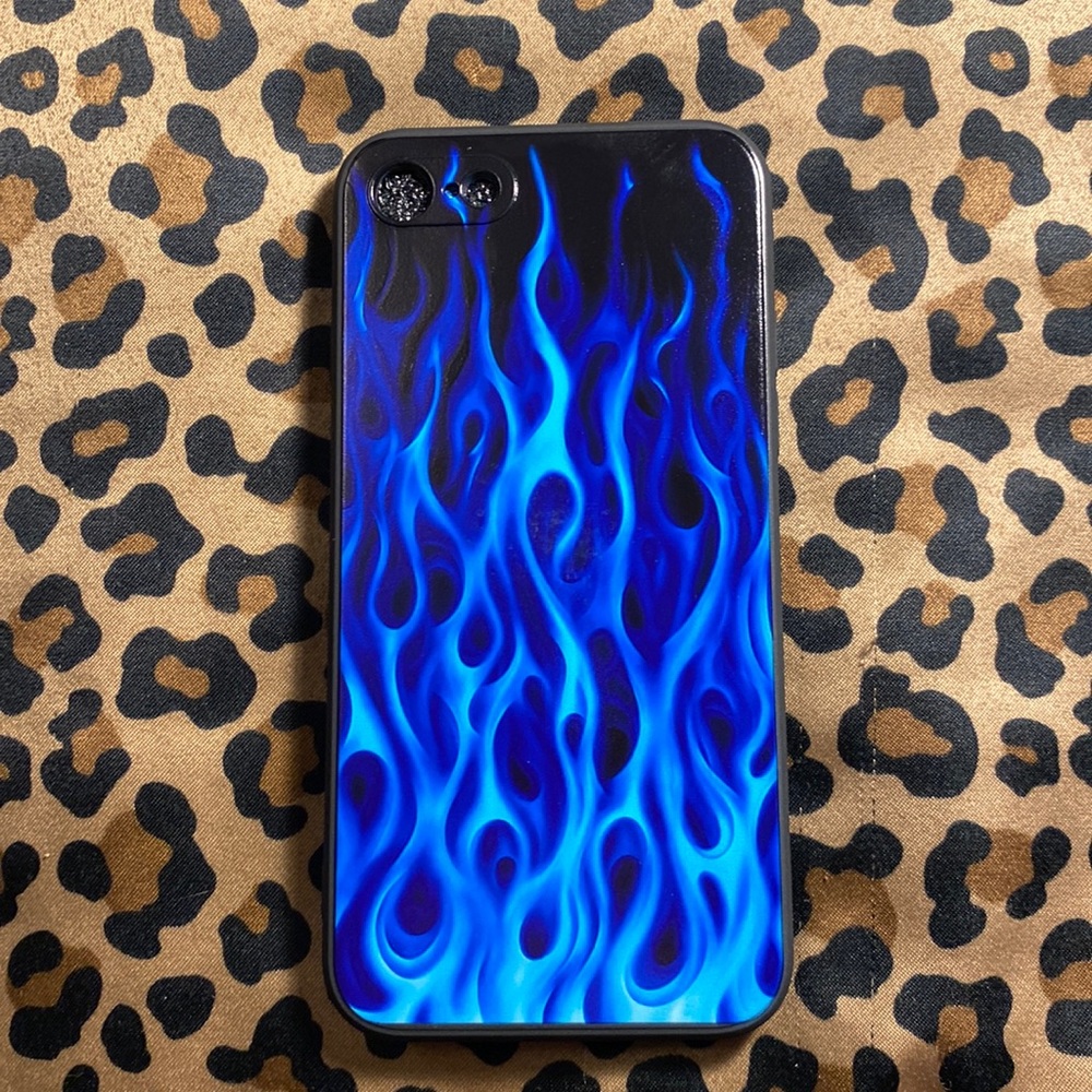 A black and blue flame phone case
